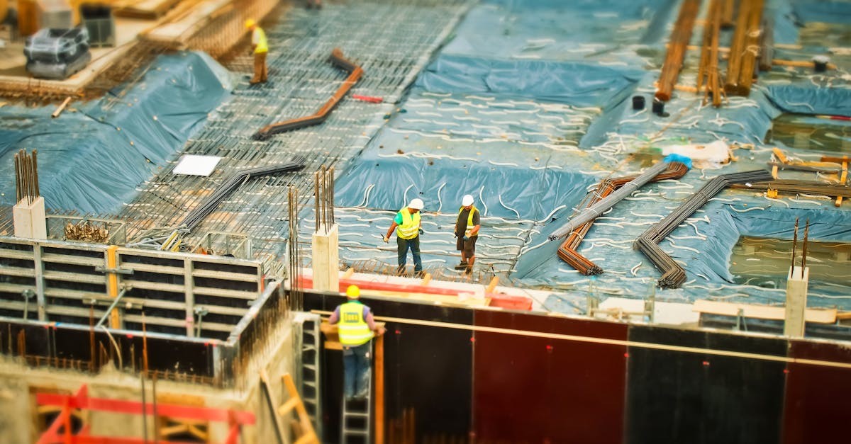 High-angle view of construction workers on a building site, engaging in construction work.